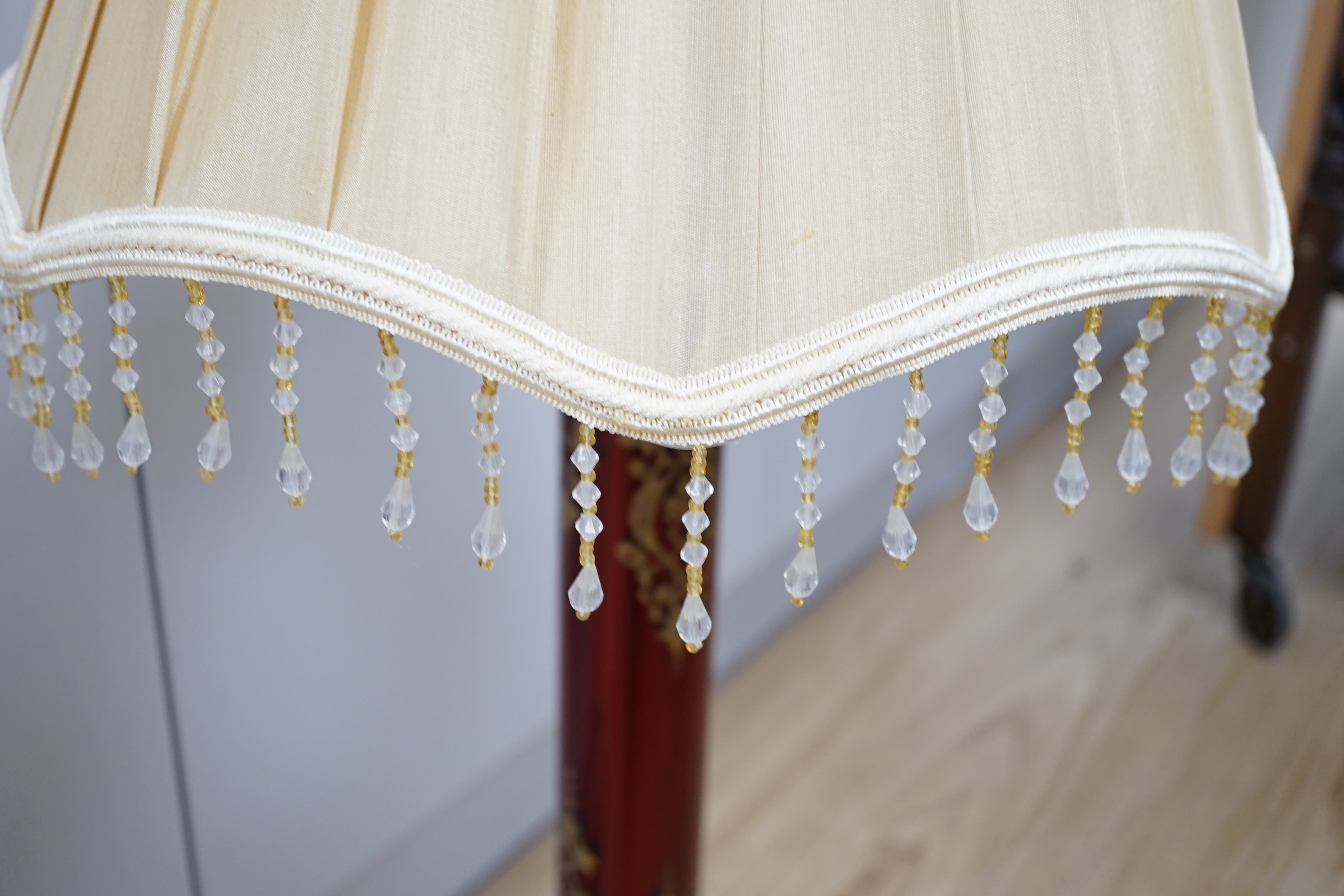 A Victorian style brass and ruby glass table lamp with shade, 81cm